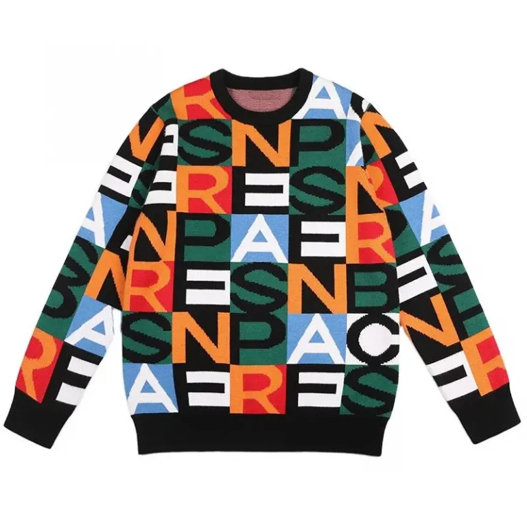 Black sweater with large multicolor letters across the body and sleeves.