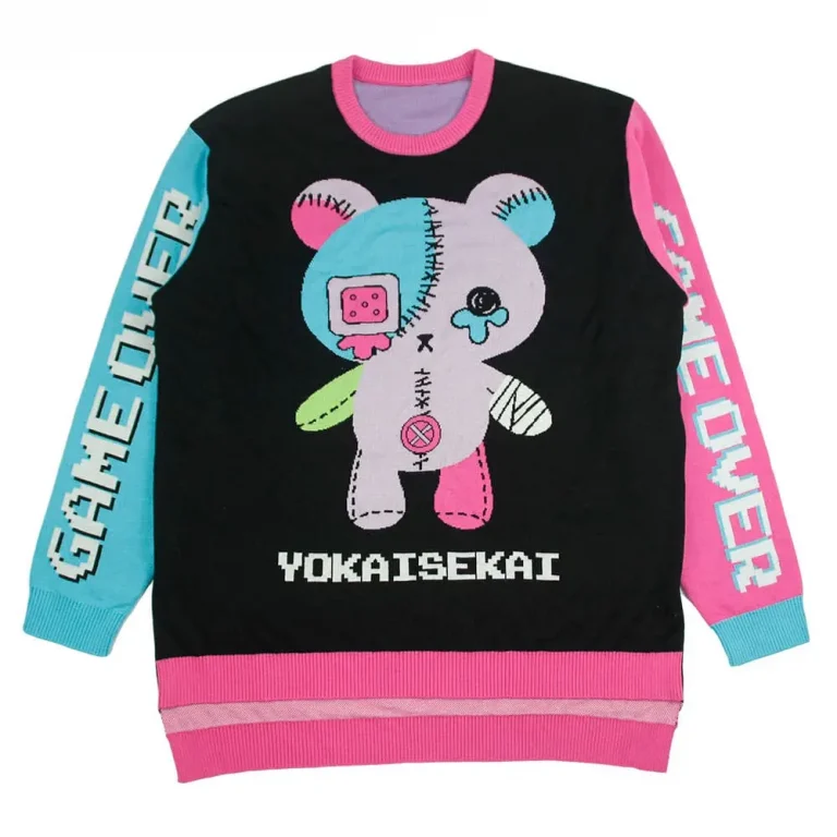 View the black crewneck sweater with a patchwork character and pink and blue sleeves.